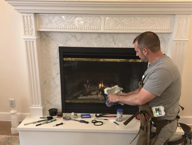 Bedford Chimney Sweep performing fireplace maintenance in Bedford, MA